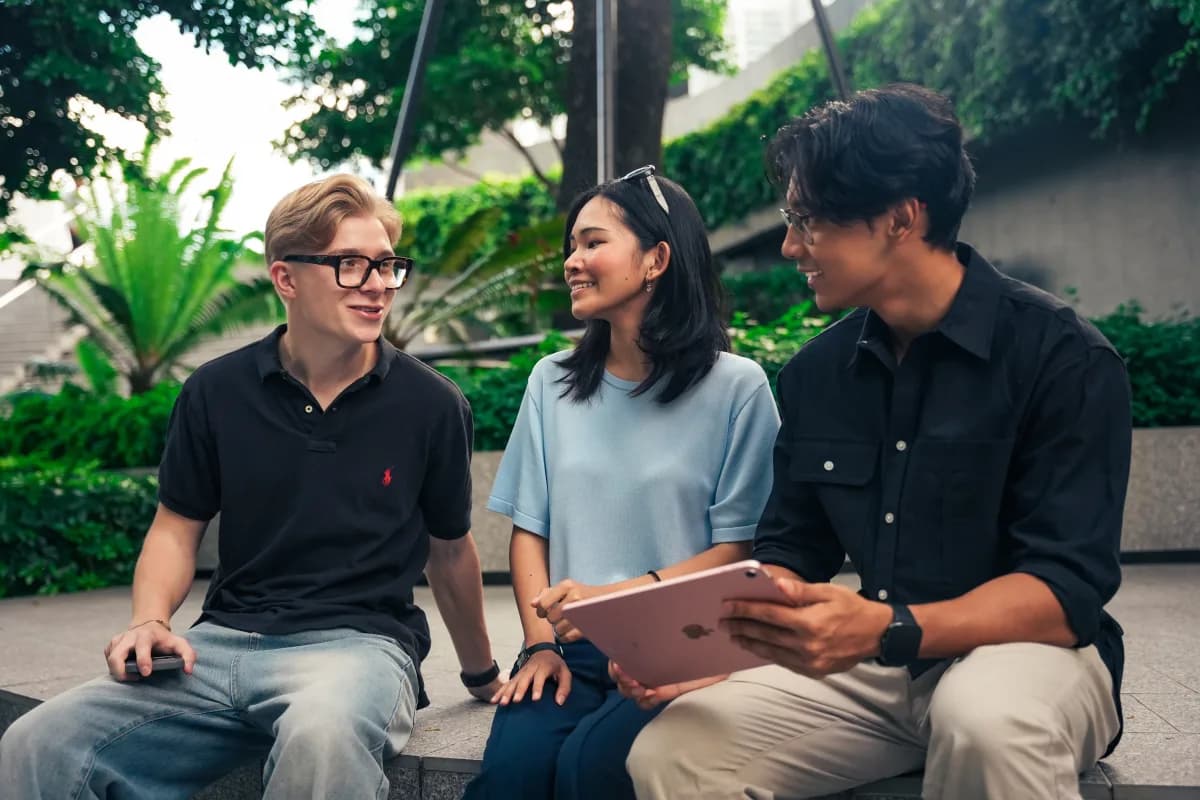 Issa Compass teammates laughing together outdoors